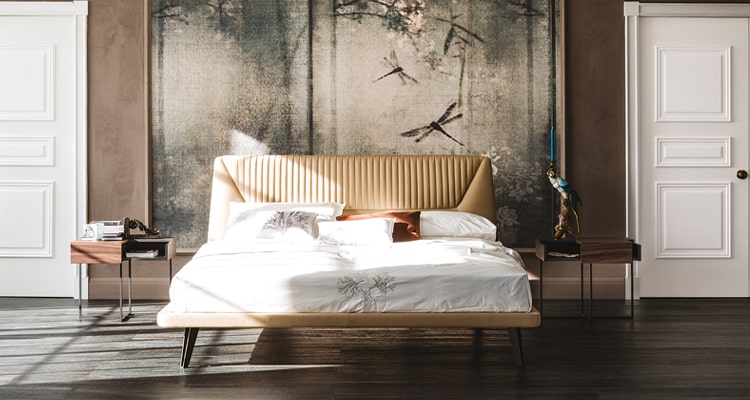 ight fabric headboard in cotton with patterned bedspread for a stylish, breezy bedroom.