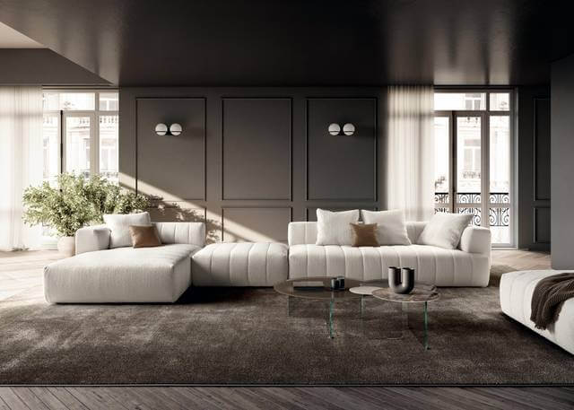 Modern living room with white modular sofa, glass coffee tables, and neutral décor, illustrating modular sofa styling tips for Indian homes.