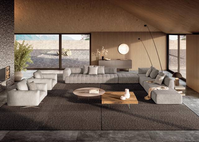 Modern living room furniture featuring a spacious sectional sofa, elegant coffee tables, and minimalist décor in a luxury open-plan setting.