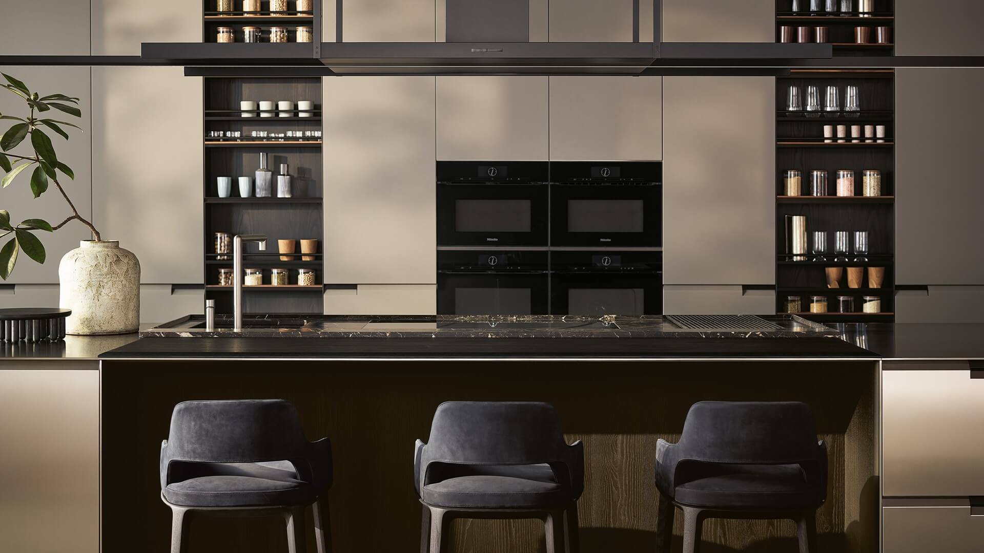 Alt Text: "Luxury teak wood outdoor sofa and armchair set with neutral cushions on a sunlit modern patio by Ventura Interiors