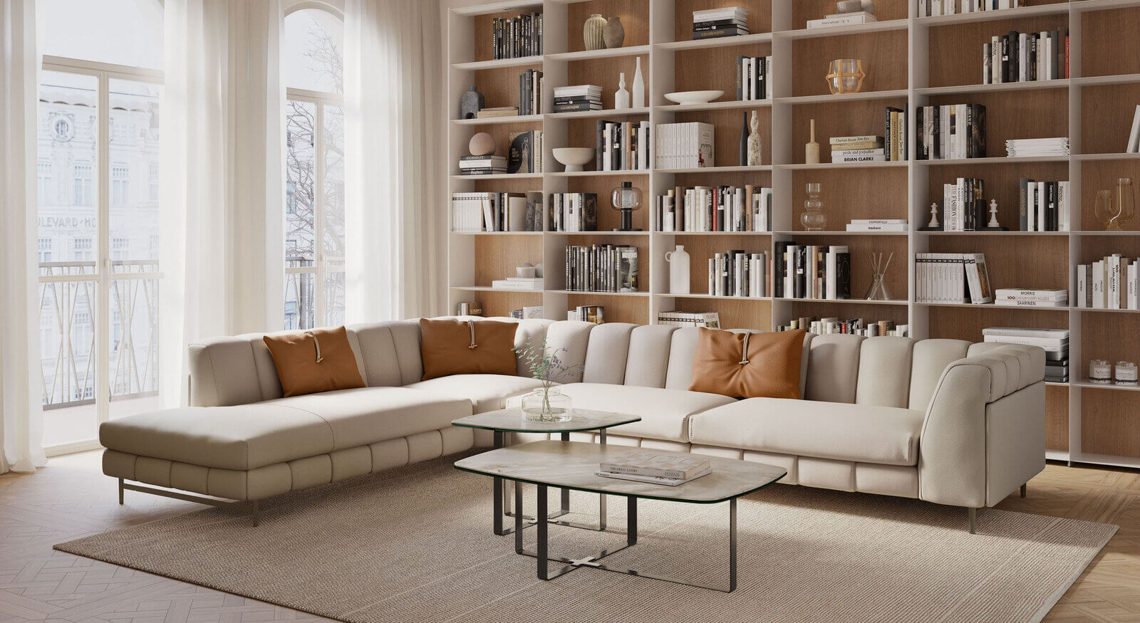 Modern living room with a neutral-toned sectional sofa and layered coffee tables, showcasing how to decorate coffee table for a luxe and cohesive look