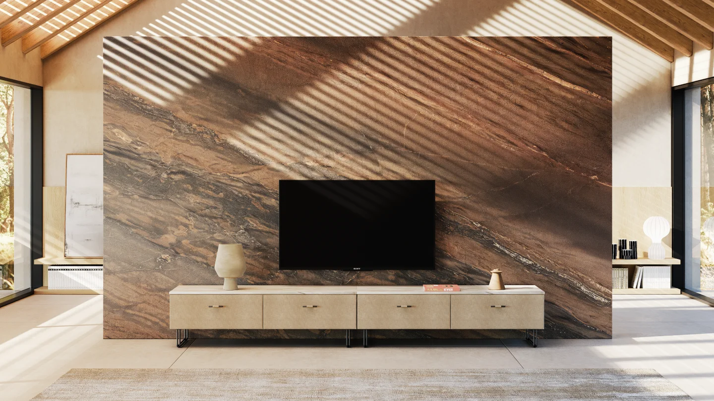 Modern TV unit styling featuring a minimalist cream console cabinet against a large brown marble-textured accent wall with natural sunlight shadows