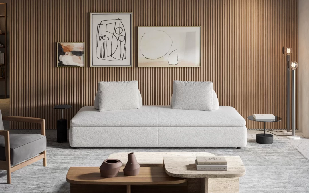 2750-Surprise-1-1080×675 Elegant white sofa bed and modern coffee tables in a luxurious living room with a wood-paneled feature wall and layered abstract artwork.