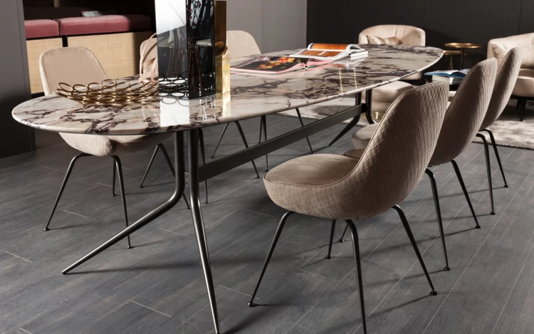 Elegant designer dining chairs in a bright modern dining room interior.