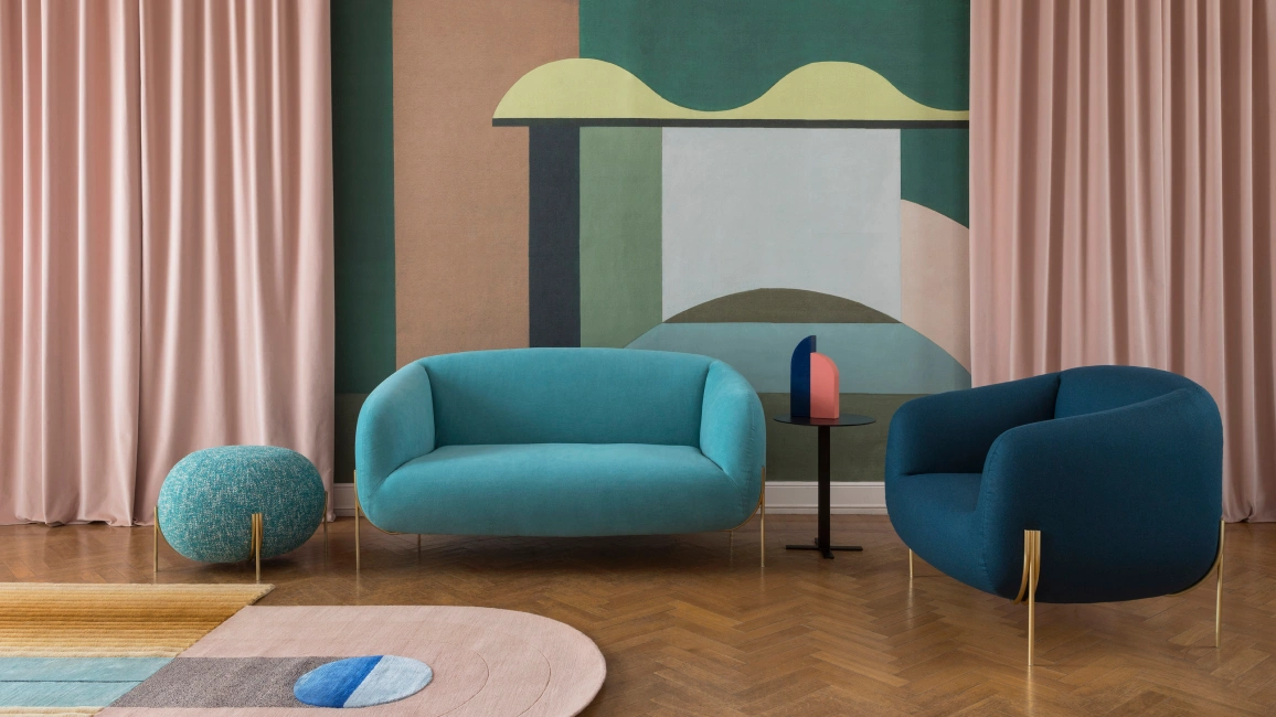 Luxury ottoman in a modern living room with plush seating and elegant decor.