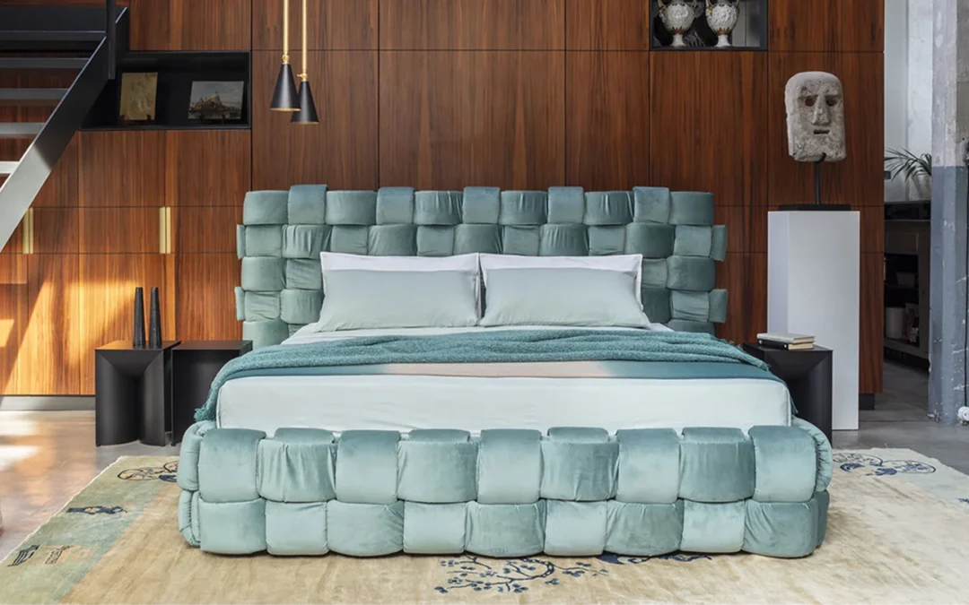Luxury upholstered bed with padded headboard in a modern bedroom, showcasing premium bedroom furniture design.