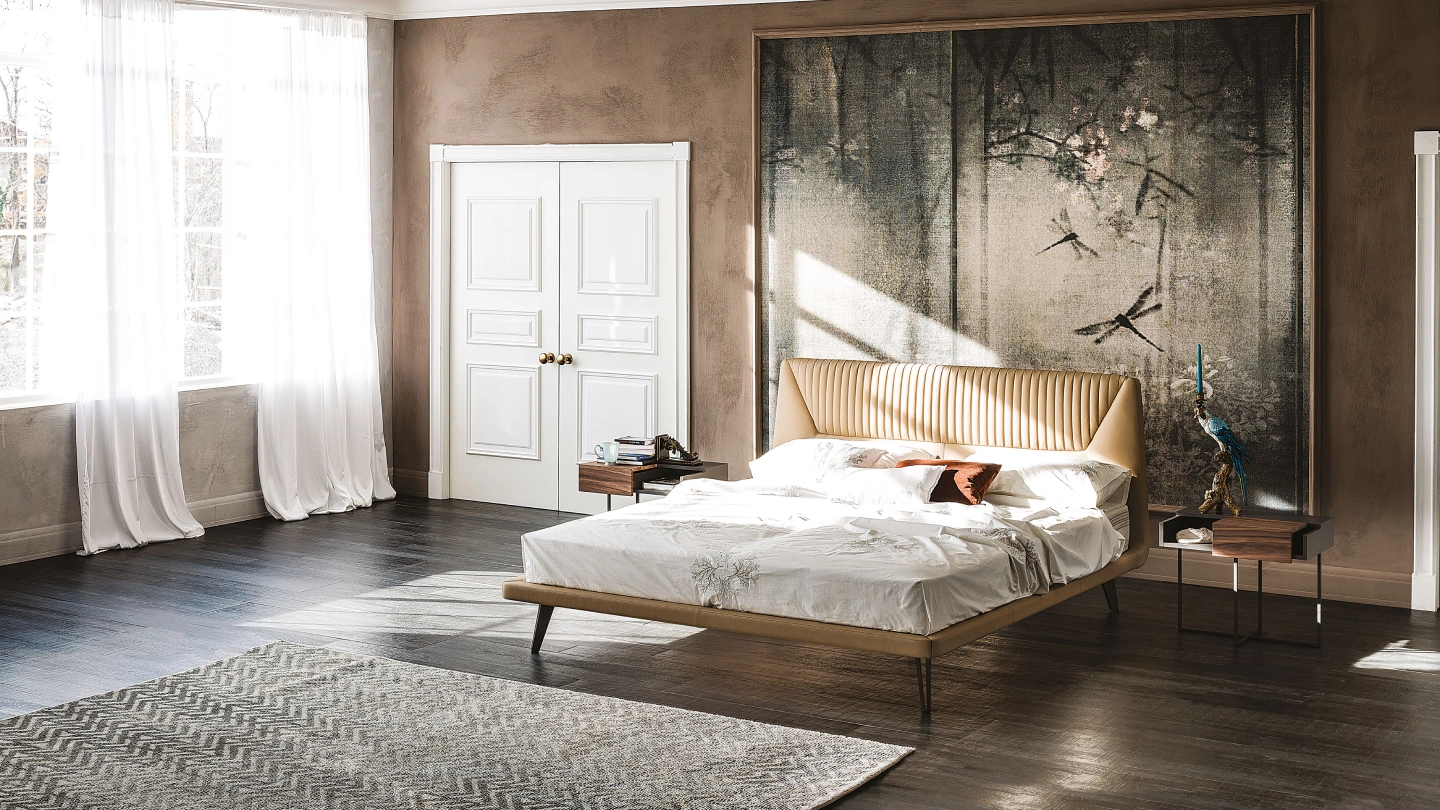 Personalized bedroom furniture featuring a tan fluted leather headboard, minimalist floating nightstands, and a large dragonfly wall mural in a luxury master suite.